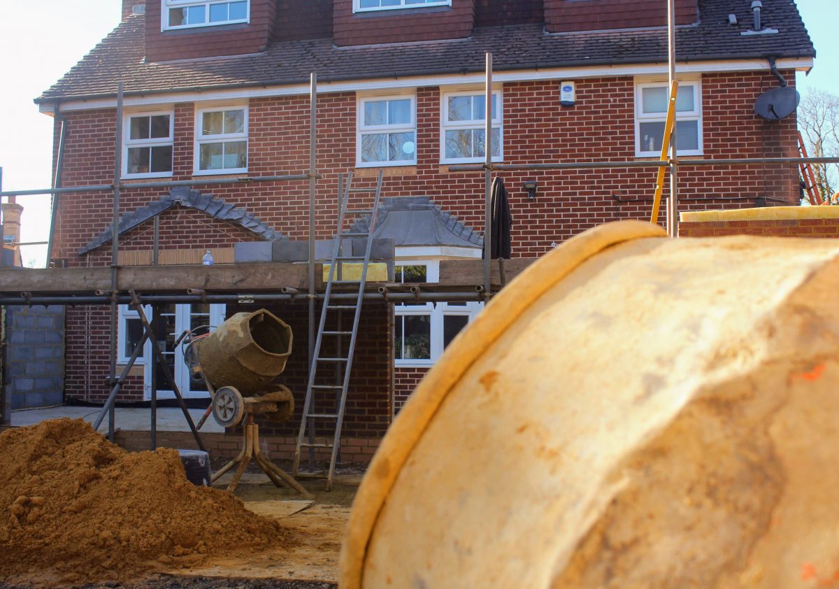 Rear extension mid-build with scaffolding and cement mixer, Crawley